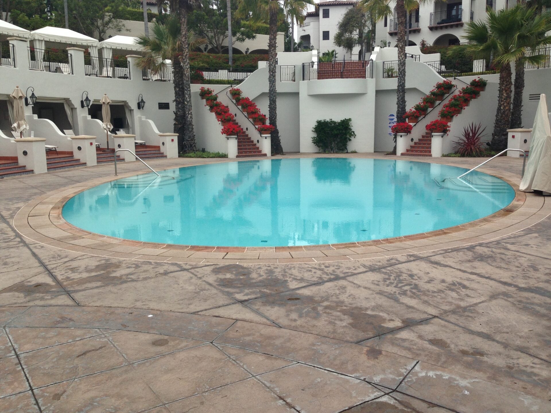 Round pool in a Spanish-style courtyard
